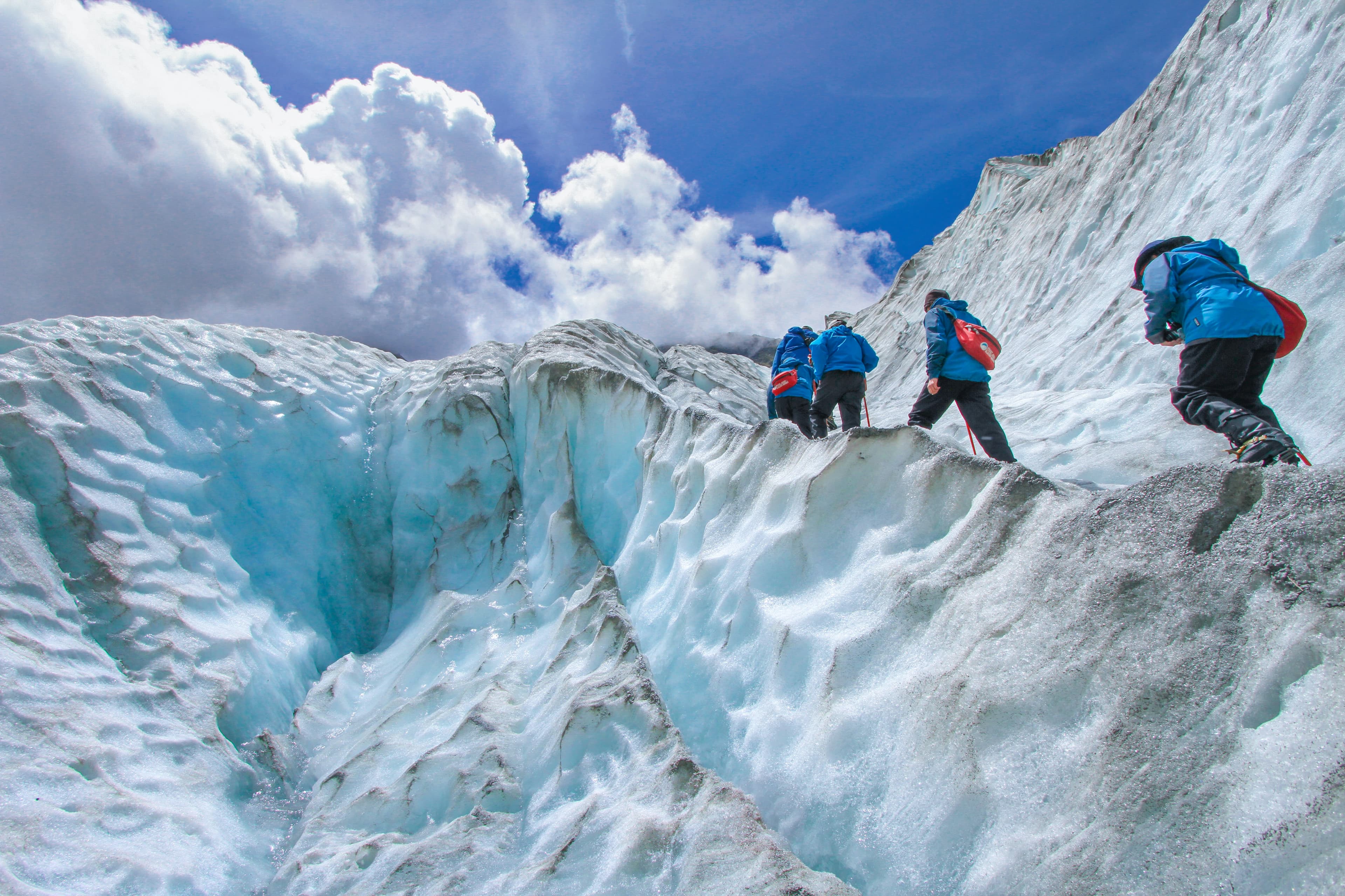 Three men hiking at high altitude